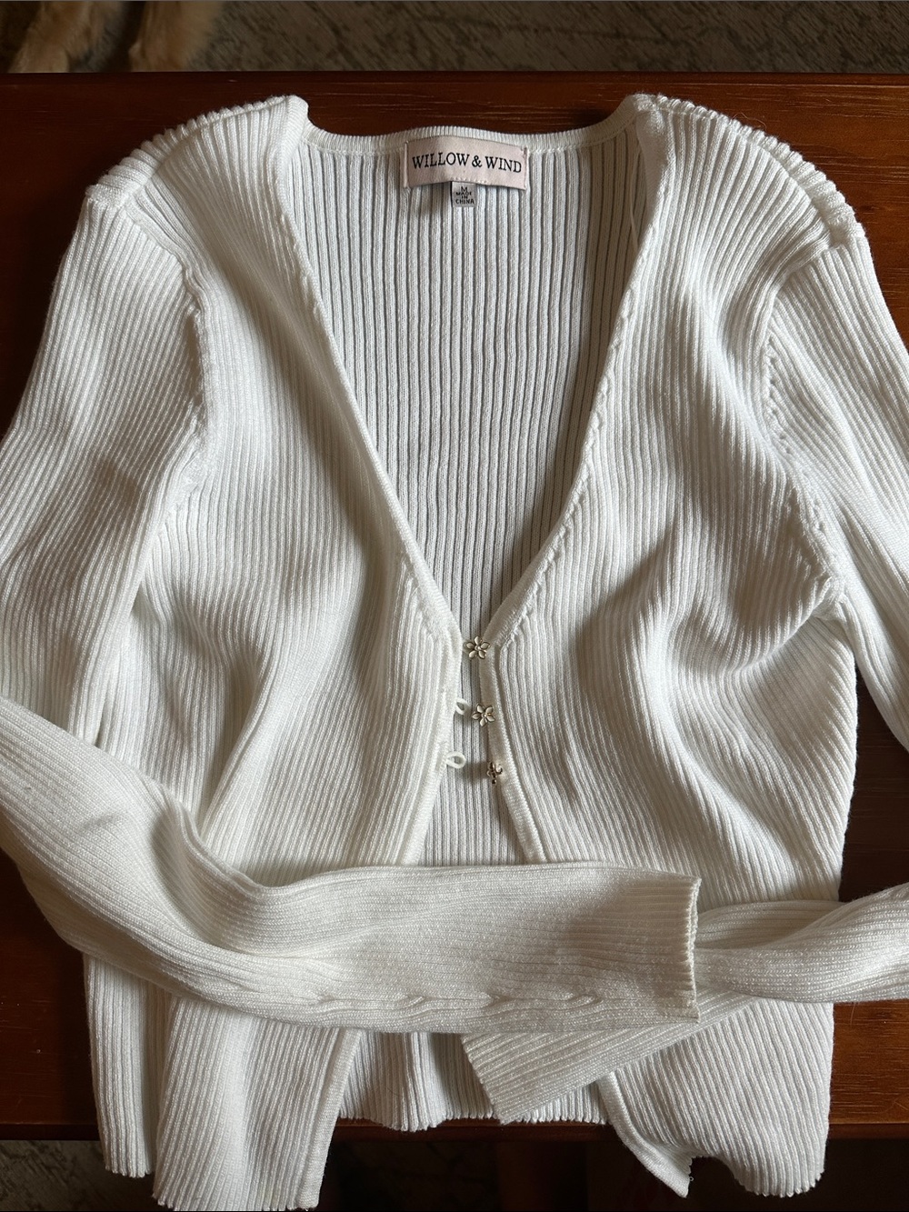 Long sleeve sweater with daisy buttons